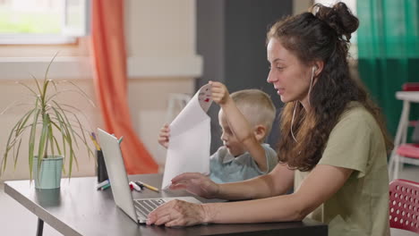 mother and son working from home