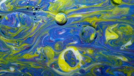 slow motion bright colors bubbles oil beautiful paint universe color moving multicolored close up. acrylic paint. fantastic hypnotic surface. abstract colorful paint metamorphosis structure bubbles