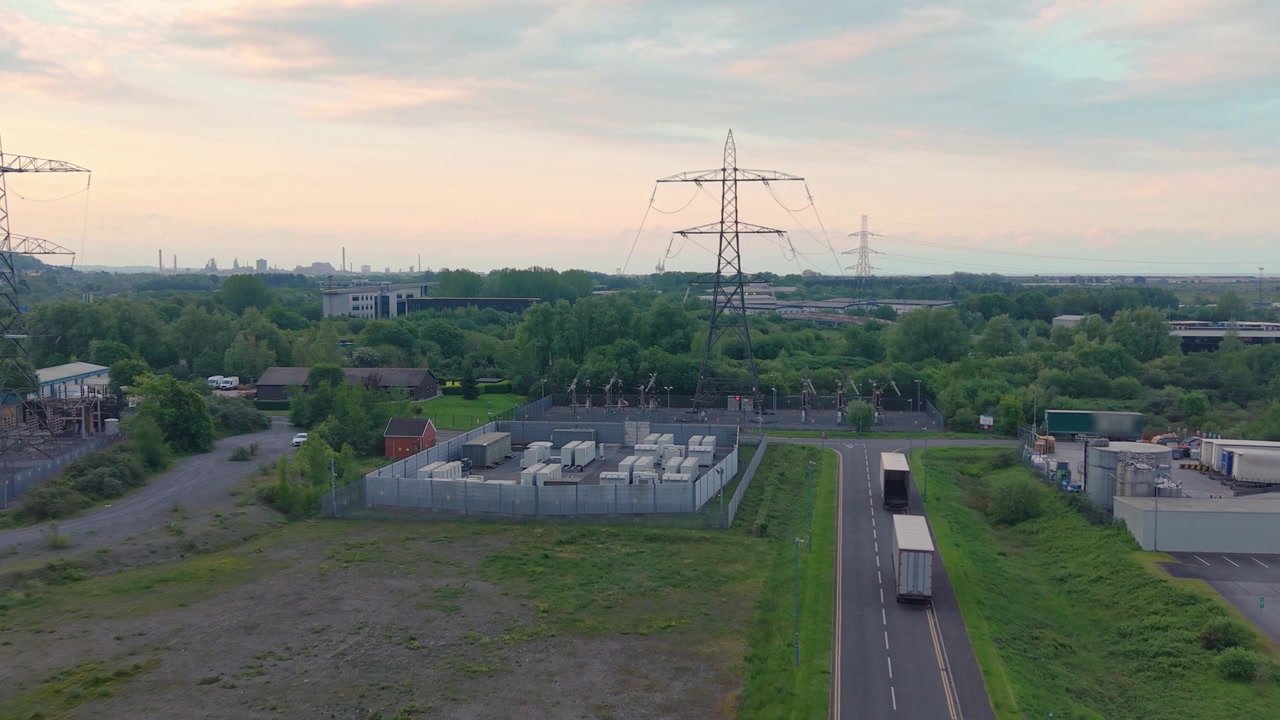 BESS Battery Energy Storage System installation made of lithium-ion from Aerial View. Modern engineering, cutting-edge data and energy management, sustainable infrastructure development in UK.
