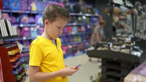boy going to school. boy buying school supplies preparing to go back to school