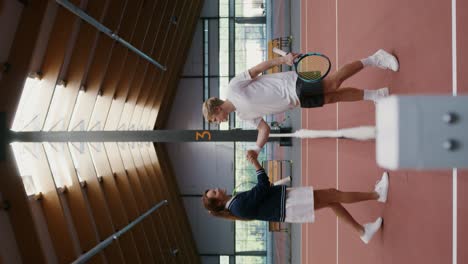 tennis players on indoor court