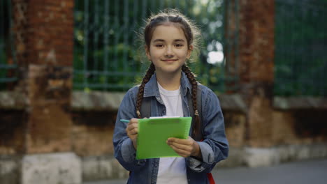 girl writing in park