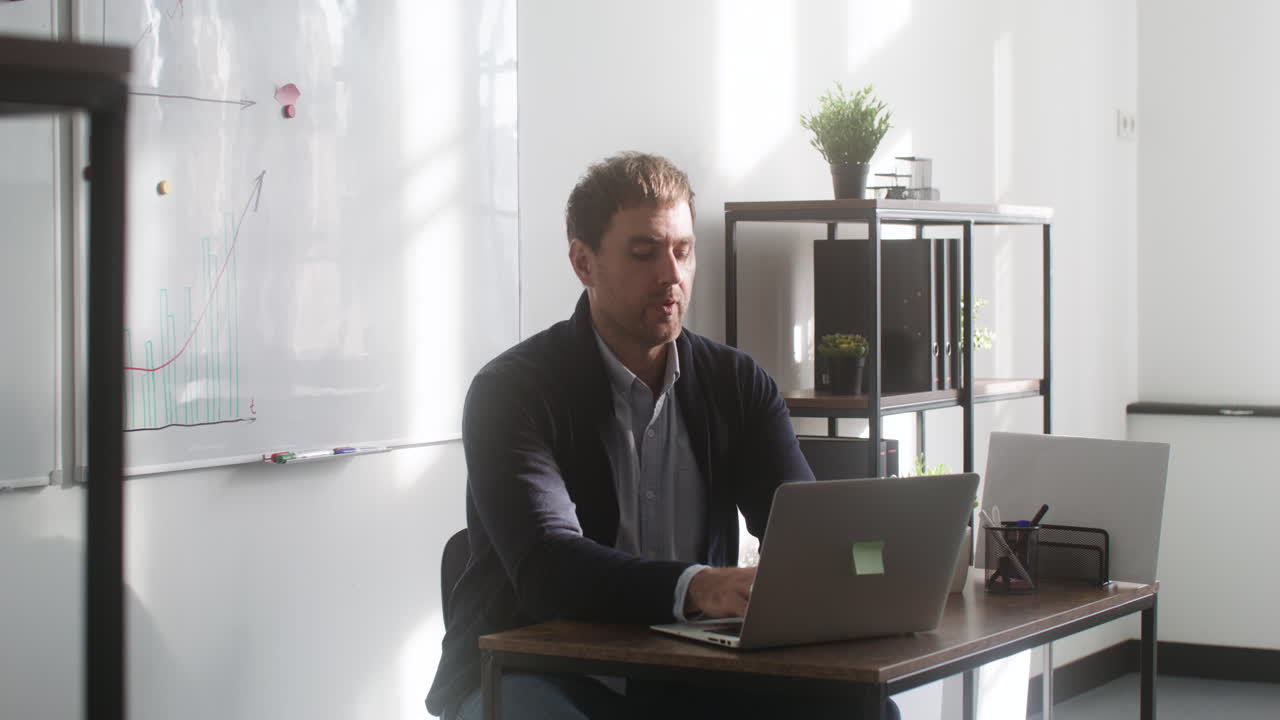Male teacher and students in classroom