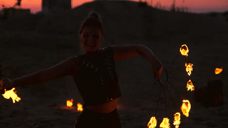 fire show artist breathe fire in the dark at abandon building slow motion. fire in heart shape.