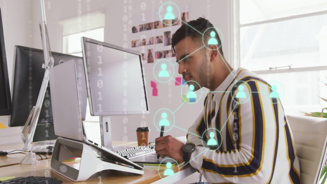 Man picking stylus sketching tablet glancing monitor tech data and network icons layering analyzing