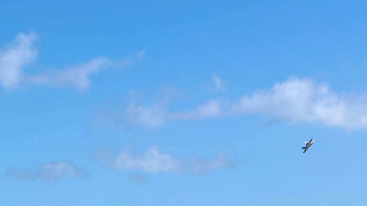 F-22 Raptor performs aerial maneuvers against a clear blue sky at Avalon Airshow, Geelong, showcasing advanced aviation technology