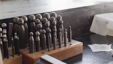 close up of handcraft tools in jewellery studio in slow motion