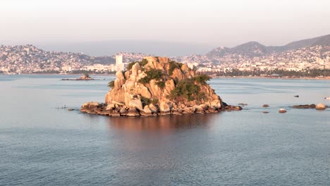 shot of little island in acapulco bay in mexico