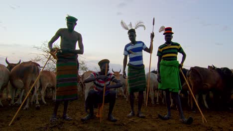 Karamojong Cattle Farmers Standing Amidst Their Cows in Uganda, Africa - Close Up