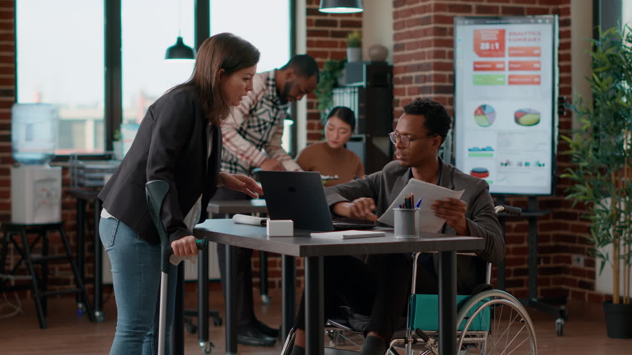 Multiethnic team of colleagues meeting in office to work on analysis