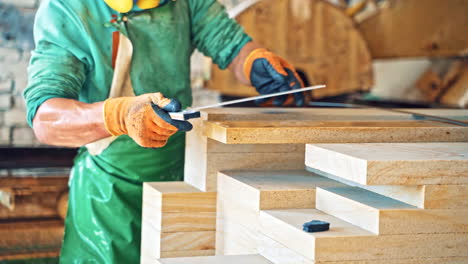 Large granite blocks. Worker at process with granite blocks