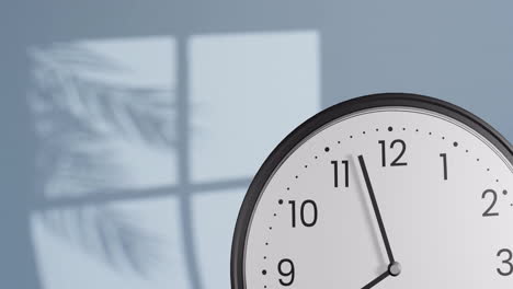 animation of fast moving hands on clock over wall with shadow of leaves and window