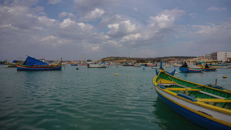 colorful fishing boats in harbour timelapse of marsaxlokk port of malta island