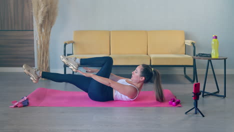 woman doing abdominal exercises at home