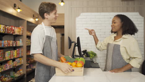 customer interacting with cashier in a grocery store