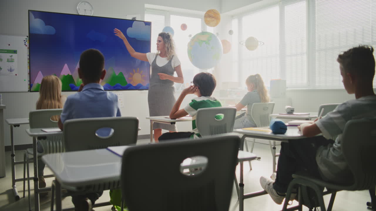 Two Cute Little Girls and Young Adorable Boy Watching Television While Sitting on a Sofa. Happy Kid