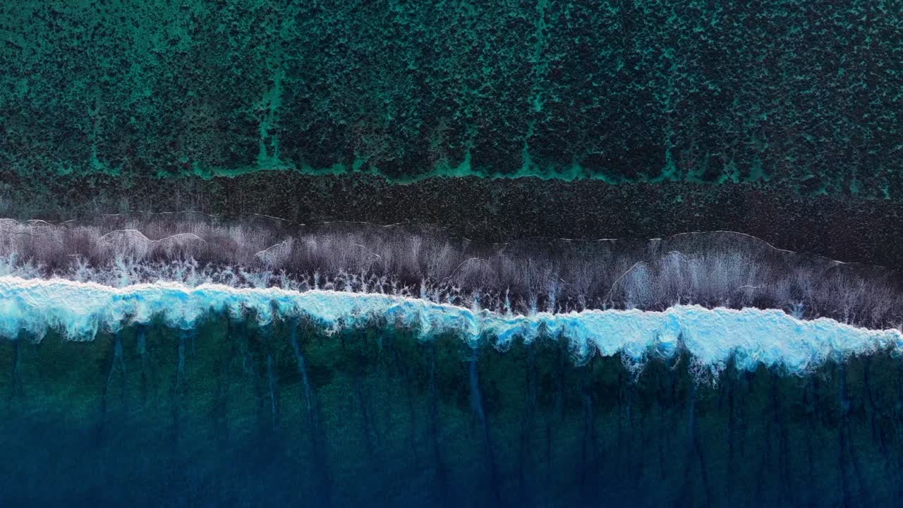 Bora Bora Moorea Mo'orea Tahiti French Polynesia aerial drone coral reef passe birdseye unique wave surf crashes on channel fingers deep aqua blue South Pacific island upwards motion