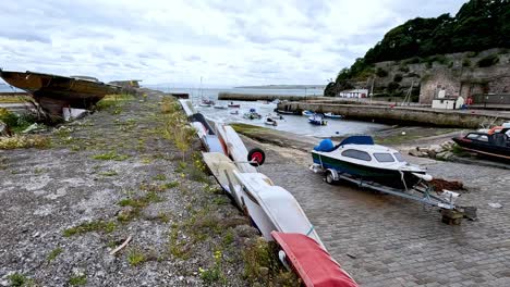 boats docked along a stone path