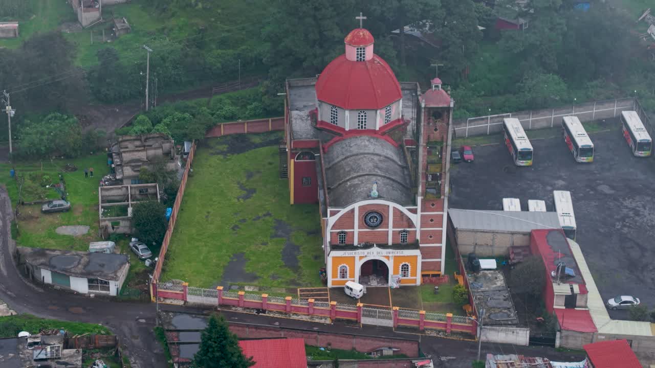 Drone views of Tres Marías church on a rainy afternoon with fog, in Morelos