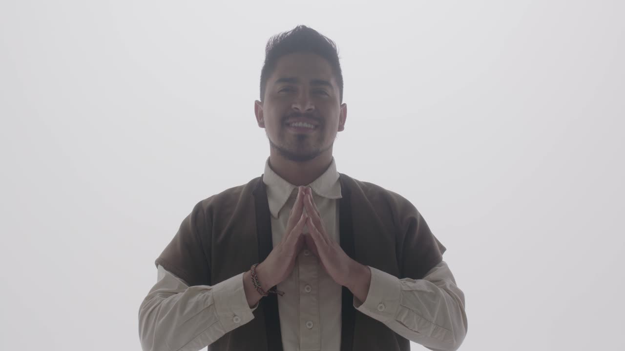 A smiling macho man folded his hands in front of her chest