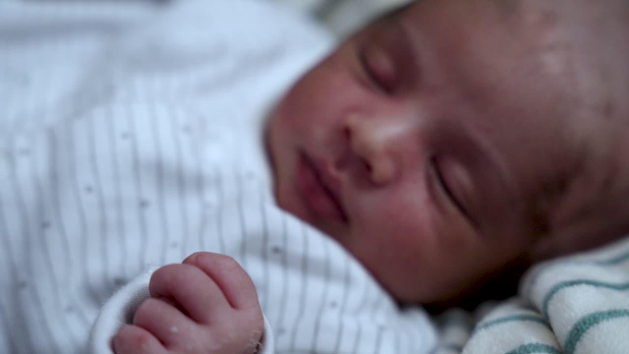 Close Up View Of Newborn Baby Napping