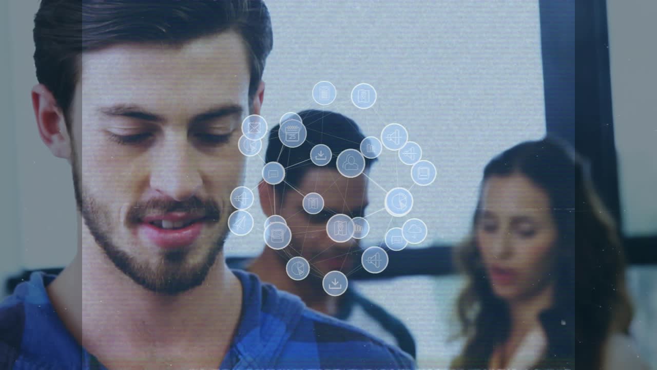 Animation of media icons over happy diverse business people in office