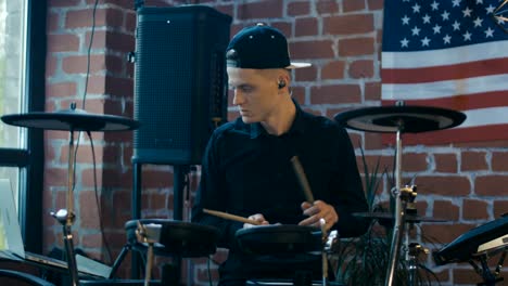 drummer recording music with laptop