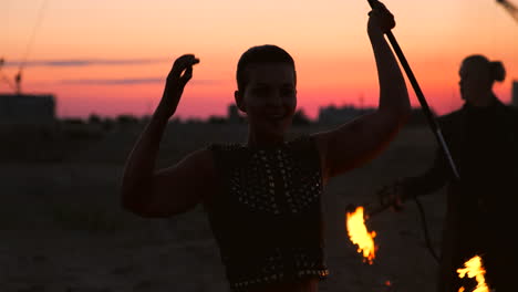 fire show artist breathe fire in the dark at abandon building slow motion. fire in heart shape.