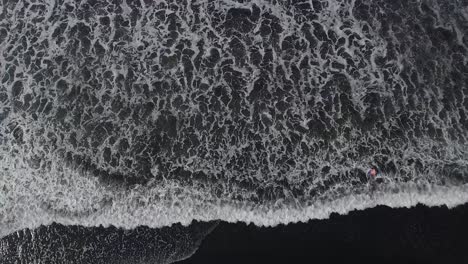 Beautiful-aerial-over-a-black-sand-beach