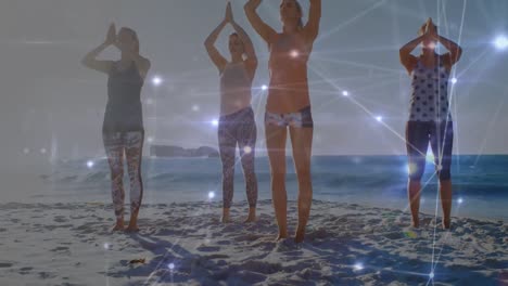 Animation-Von-Verbindungen-über-Verschiedene-Frauen,-Die-Bei-Sonnenuntergang-Am-Strand-Yoga-Praktizieren