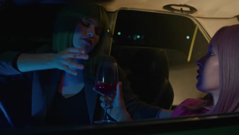 nighttime car ride with stylish women
