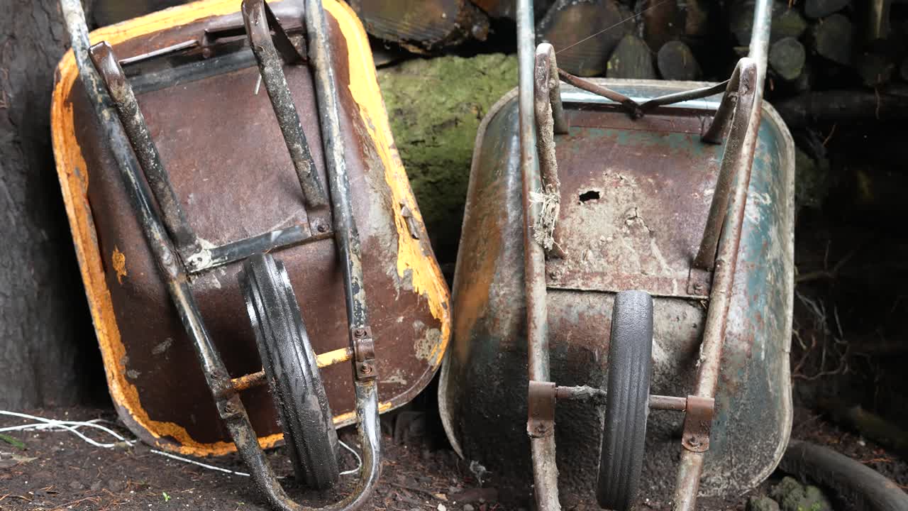 rusty wheelbarrow in the farm garden