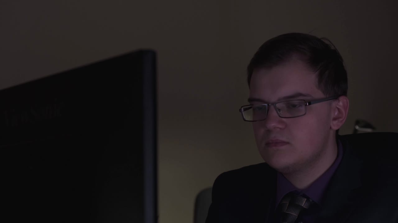 Man Working on Computer at Night