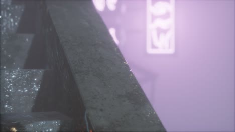 neon lights in soft focus on street with fog at night