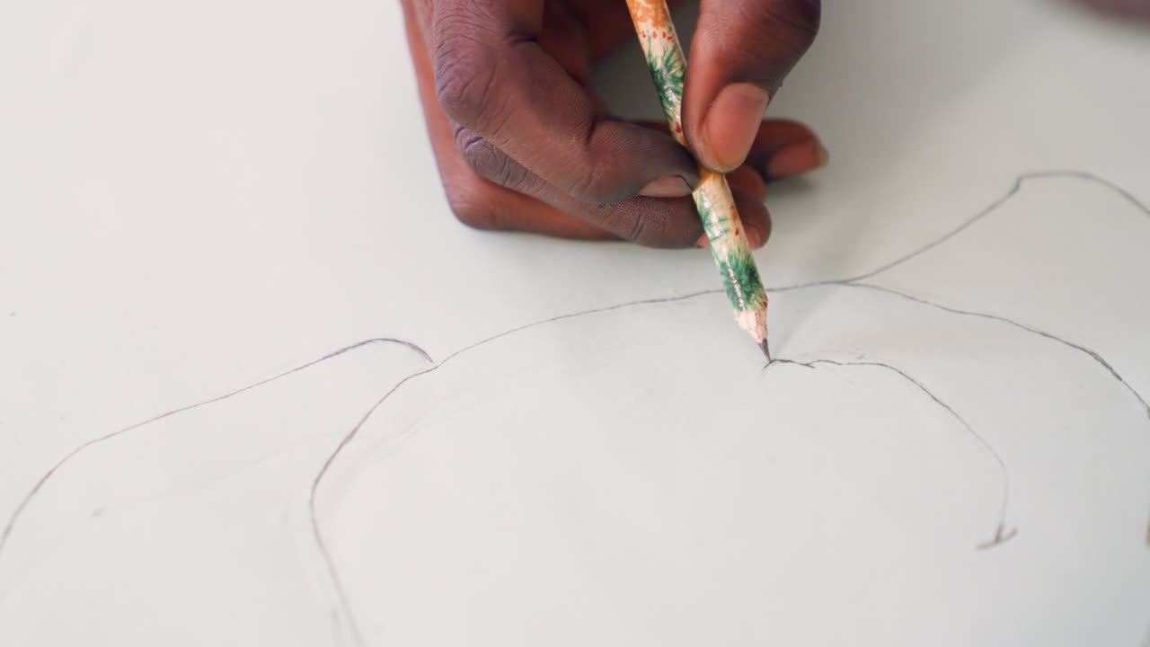 Black hand tracing petal lines on paper, closeup of black illustrator mapping painting composition with worn green pencil, dotted guide marks, concentrated gesture, minimal background, studio workshop