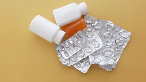 empty pill bottles and foil packaging