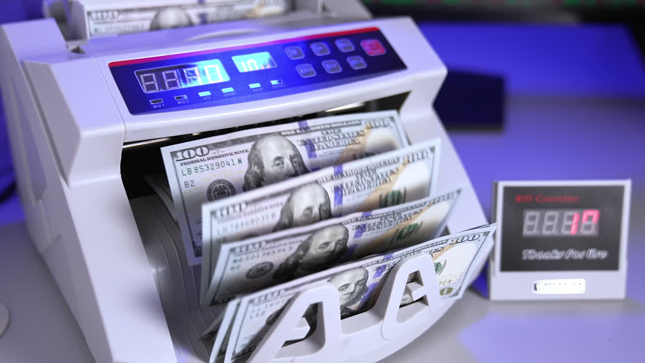 Modern electronic machine. Machine counter automatically calculates a large amount of dollar banknotes. Top view. Business accounting.
