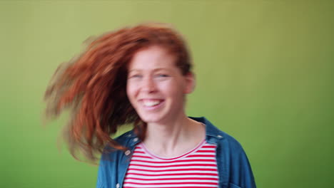 happy young woman with red curly hair