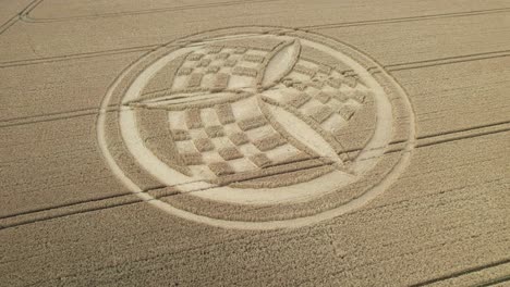 establishing aerial view over south wonston propeller crop circle to reveal golden hampshire wheat field countryside