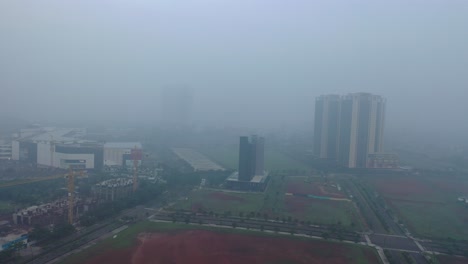 foggy cityscape with construction and development