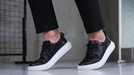 stylish black leather sneakers with white soles