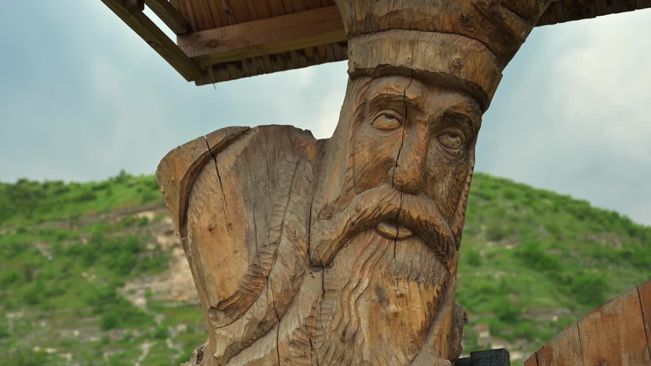 Wooden sculpture on a gate in Old Orhei, Moldova