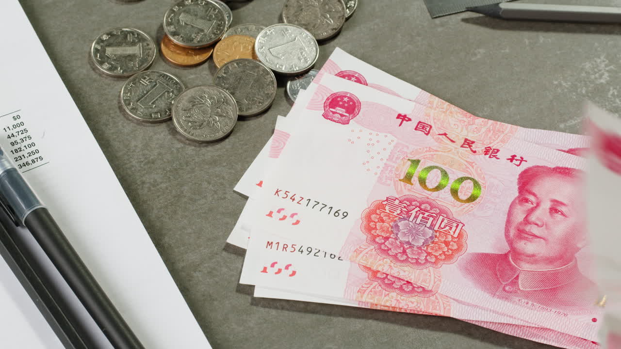 Chinese Currency and Documents on a Desk