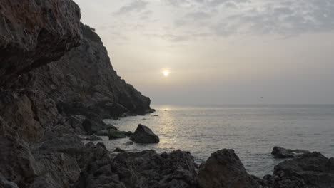 time-lapse-captures-misty-sunrise-at-rocky-seaside