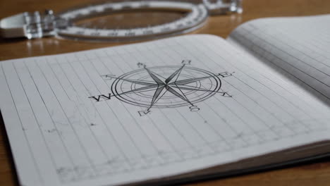 compass drawing in a notebook