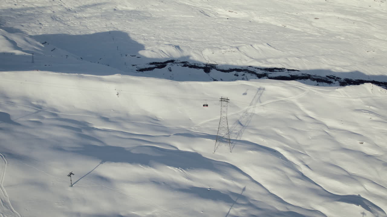 Aerial of a gondola in the Swiss alps, Laax, Switzerland, daytime