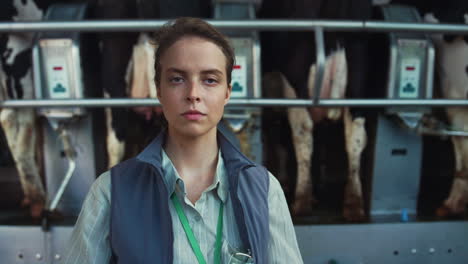 livestock farmer posing milking facility portrait. dairy products manufacture.