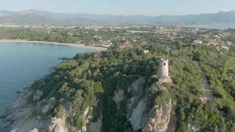 aerial view of san gemiliano tower old stone castle fortress on east coastline of sardinia, italy