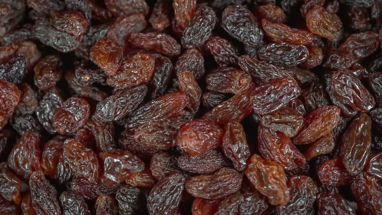 Many raisins at rotating background - looping video