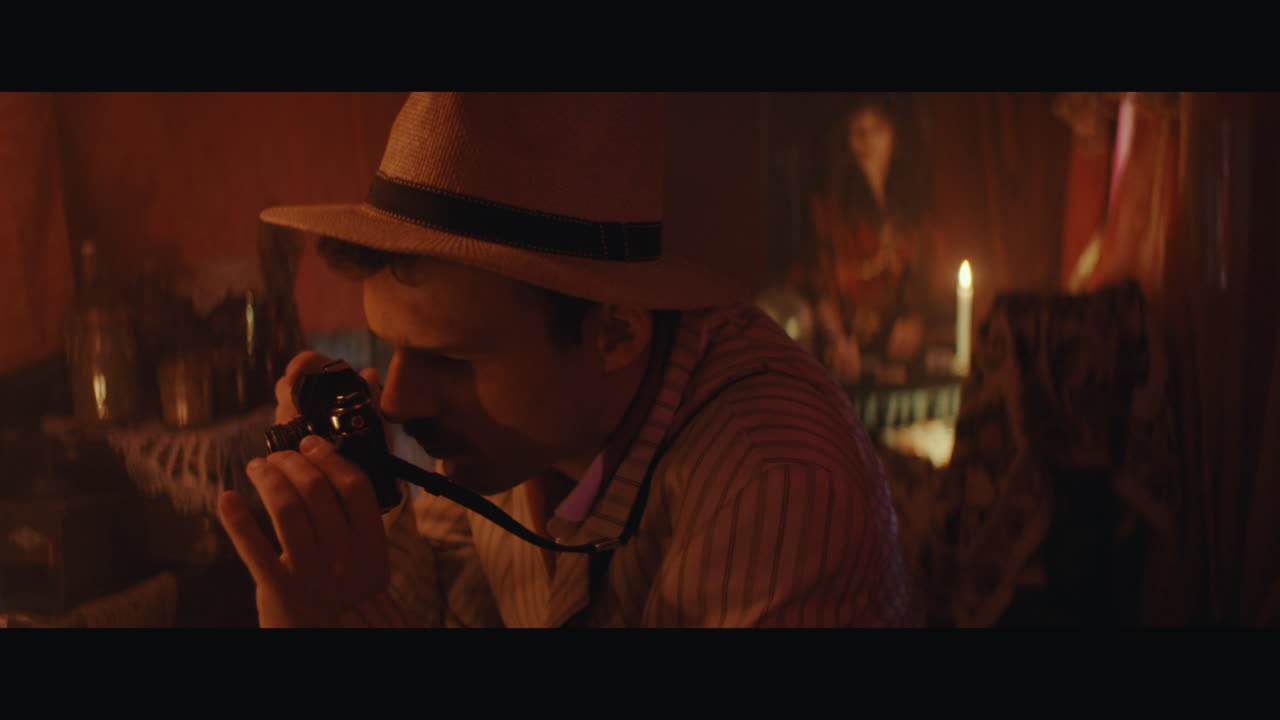 A man takes a photo inside the gypsy circus cart